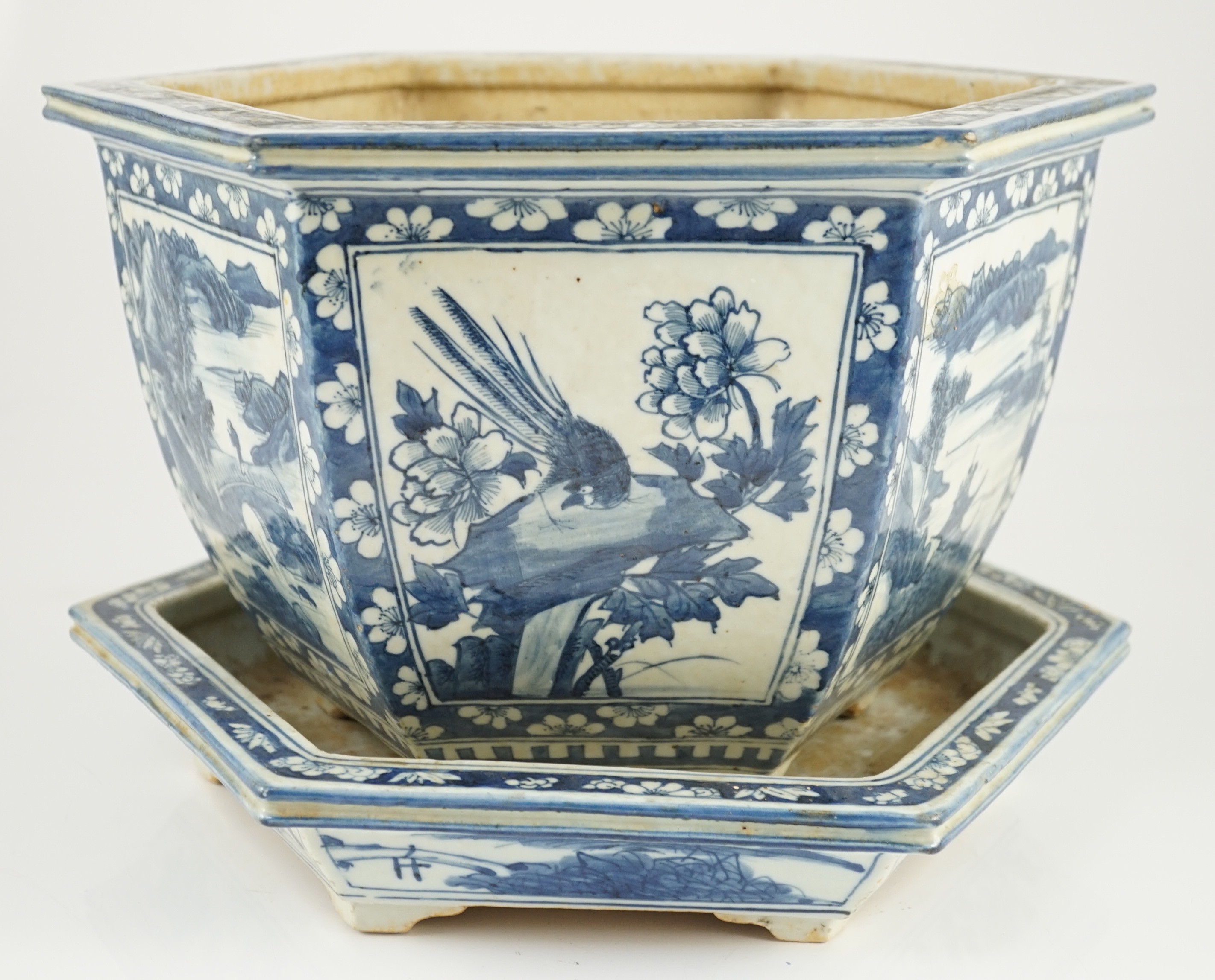 A Chinese hexagonal blue and white planter and underdish, 19th century, 35cm wide, two rim chips